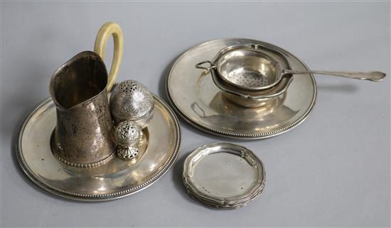 German 800 tea strainer and stand, German silver milk jug, pair Austrian circular stands, set 5 ashtrays and Indian salt & pepperette